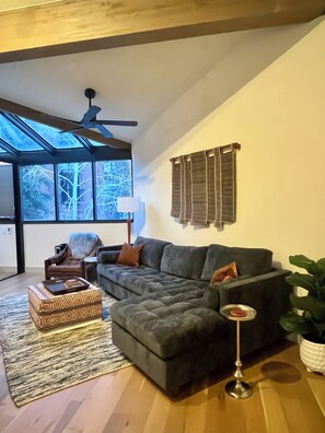 Comfortable seating with custom upholstery sheepskin throws and leather armchair