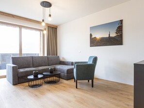 Furniture, Interior Design, Flooring, Floor, Couch, Wood, Wood Flooring, Living Room, Room, Ceiling