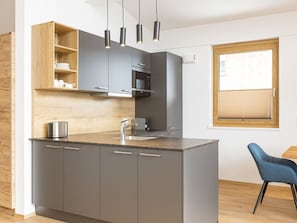 Furniture, Kitchen, Countertop, Flooring, Cabinetry, Interior Design, Wood, Floor, Kitchen Appliance, Cupboard
