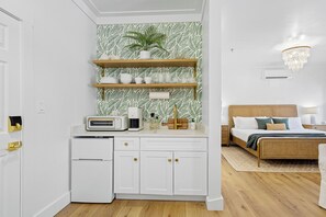 Kitchenette in condo features a toaster oven, Keurig coffee maker, mini fridge/freezer, and dishes!