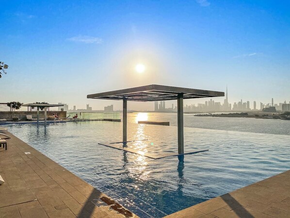 Infinity Pool: Dive into breathtaking skyline views as the sun sets over Dubai's vibrant horizon!