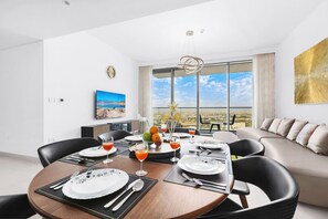 Dining Room: Dine with stunning views and chic decor, perfect for memorable meals and laughter!