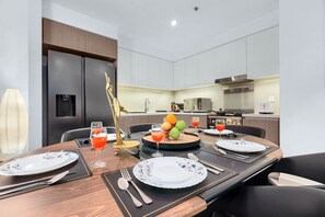 Dining Room: Savor delicious meals surrounded by modern flair and vibrant city views!