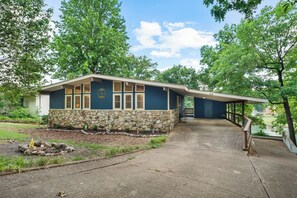 Your vacation haven awaits you! Built in 1967, you'll find this home a well-preserved example of a mid-century bungalow