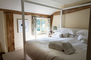 Bedroom one with a super-king size four-poster bed