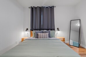 Queen size bed with private full bathroom access.