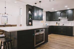 The heart of the home: Redpine's modern kitchen. Designed with both aesthetics and functionality in mind, this space is perfect for whipping up gourmet dinners or quick breakfasts.