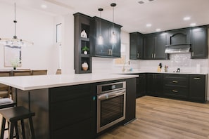 The heart of the home: Redpine's modern kitchen. Designed with both aesthetics and functionality in mind, this space is perfect for whipping up gourmet dinners or quick breakfasts.