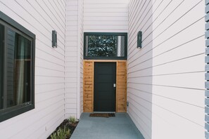 From the street, this striking entrance draws you into a beautifully designed home, ready to host your perfect getaway.