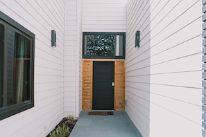From the street, this striking entrance draws you into a beautifully designed home, ready to host your perfect getaway.
