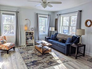 Relax after a day exploring in the airy living room, complete with Smart TV/Roku
