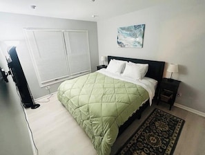 Spacious bedroom with a smart TV for your entertainment.