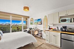 King-size bed with picturesque garden views