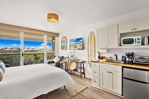King-size bed with picturesque garden views