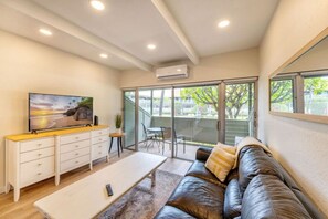 room, Living room with Smart TV. Tennis court view from the balcony.