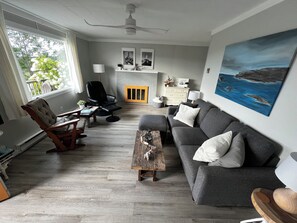 Our updated and bright living room with views of Whale Cove & North Head 