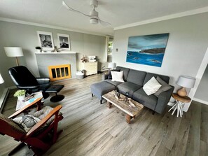 Our updated and bright living room with views of Whale Cove & North Head 