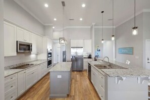 A chef's dream kitchen offers stainless steel appliances and granite countertops