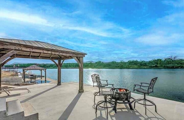 Lakeside Covered Patio with Fire Pit and seating
