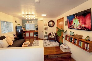 You will enjoy the TV from both the living room area and the bed. 