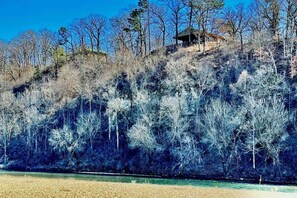 The Illinois River, the bluff, and the Buffalo Cabin. The cabin to the left should be renovated soon. Tell your friends.