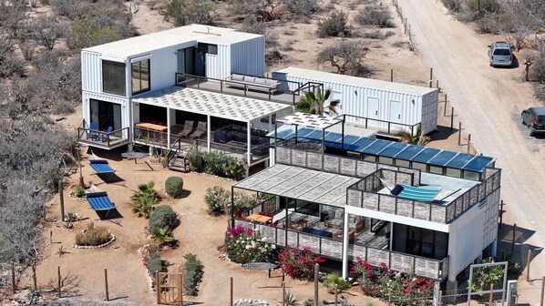Repurposed shipping container homes.  30 Knots on the left (3 bedrooms, 3 bath) and 20 Knots on the right at the corner of Corredor Mar de Cortez and C. Estrella de Mar in El Sargento.