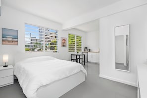Bask in the natural light pouring through large windows, offering a calming view of the outdoors and creating a peaceful, serene atmosphere throughout your stay.