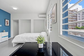 Retreat to a spacious bedroom that seamlessly combines comfort and sophistication.
