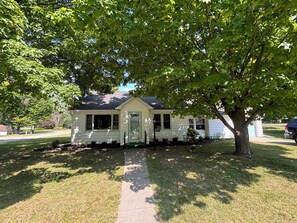 EXTERIOR:  Another photos of the front of the home in Summer