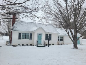 EXTERIOR:  Another shot of the front of the house in Winter