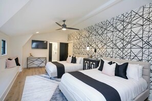 3rd Level: Bedroom 3 with 2 Queen Beds, SmartTV, closet, and en suite double vanity bathroom.