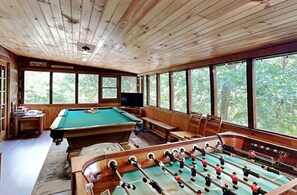 Spacious Game Room with pool table, foos ball, TV, and plenty of board games