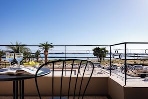 There is a balcony with a table and chairs where you can enjoy the view.