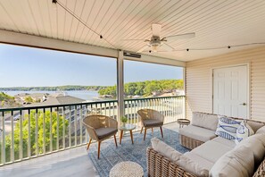 Lounge the day away with water views on the screened balcony