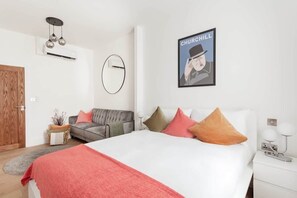 Second bedroom with king bed, sofa bed, and full air conditioning for comfort.
