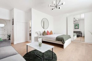 Master bedroom with king bed, sofa bed, ensuite, and refreshing A/C.