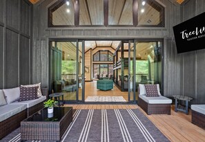 A warm and inviting entry welcomes you into a space where stylish design meets cozy cabin vibes, setting the stage for an unforgettable getaway.