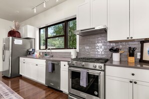 Fully stocked kitchen with both a drip and k-cup coffee maker. 
