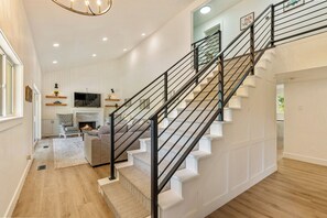 Stairs go up to 4 bedrooms, 2 bathrooms, and a loft space. 