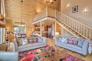 Spacious living area with rustic stairs