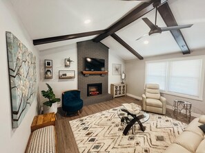 LIVING ROOM includes TV and FIREPLACE