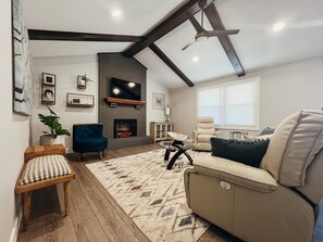 LIVING ROOM includes reclining leather couch. 