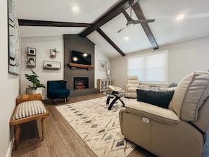 LIVING ROOM includes reclining leather couch.