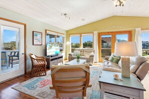 Unwind in the spacious Top-Level Living Area with plenty of natural light and a large, flat screen TV that's perfect for watching your favorite shows.