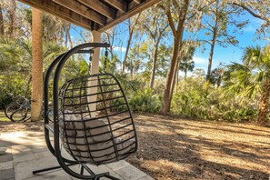Step onto the private porch to fire up the electric grill amidst tranquil garden views.