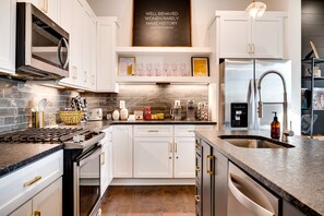Fully equipped kitchen with Keurig coffee maker and pods provided as well as all you'd need to make a home cooked meal