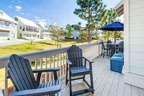 Large patio off living room features two seating areas.