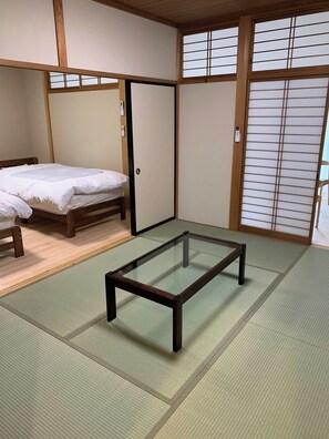 A Japanese-style room next to Bedroom 1. A kotatsu is available in the winter. When there are a large number of people, futons can be laid out here as well.