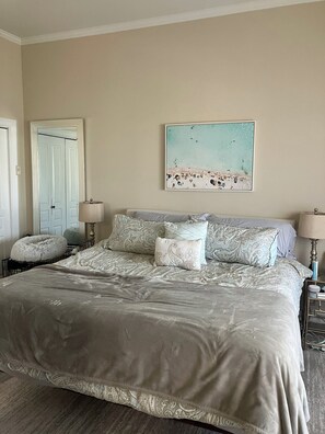 Prime bedroom features a King bed with hotel quality bedding, and ensuite bath.