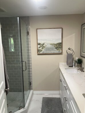 This is the private, attached bathroom for the prime bedroom.